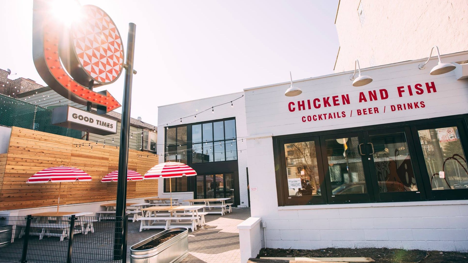 outdoor restaurant with umbrellas and takeout counter